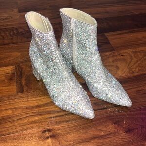Betsy Johnson’s sparkly boots with turquoise bottoms